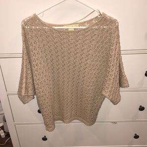 Cream colored short sleeve knit sweater
